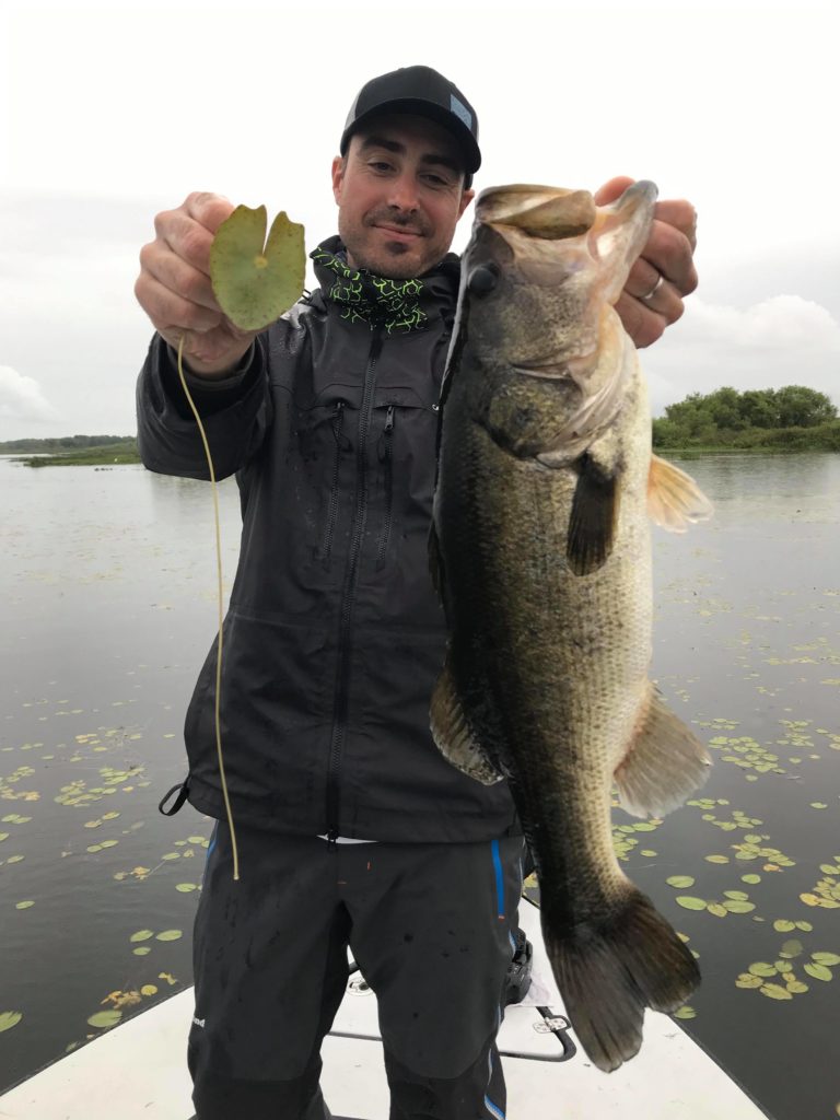 Valentin poses with this magnificent bass that was hiding in the water lilies